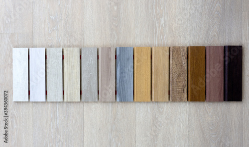 Fotografie Samples of wood of different colors and species for laminate and parquet flooring