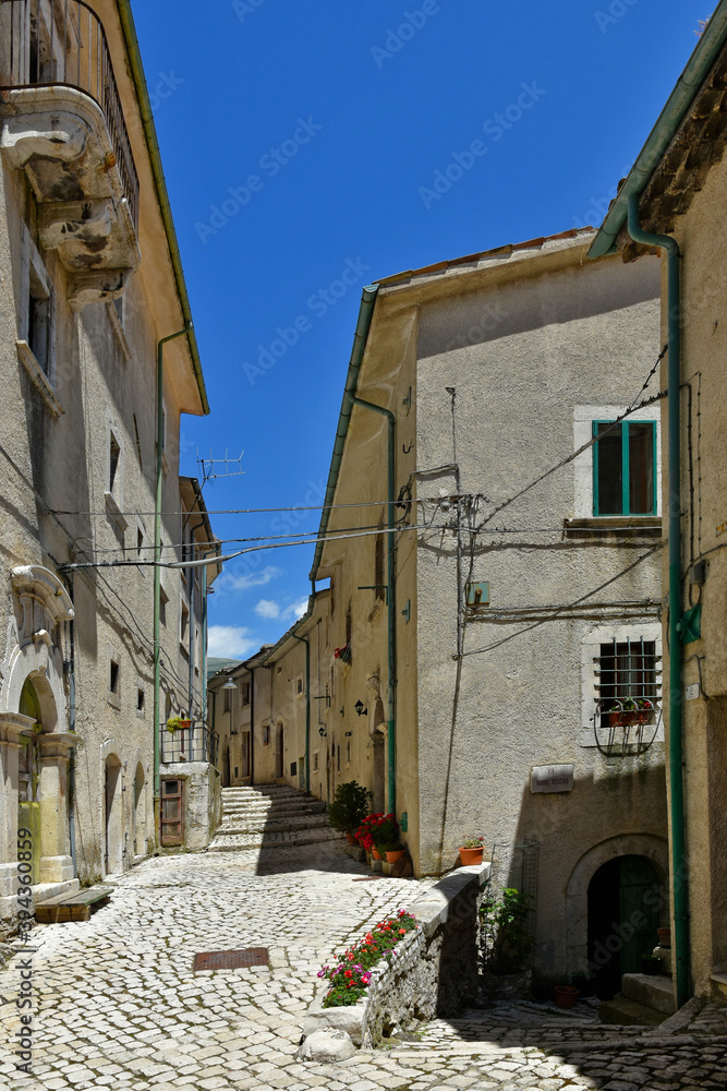 A narrow street among the old houses of Civitella Alfedena, a medieval village in the Abruzzo region, Italy.