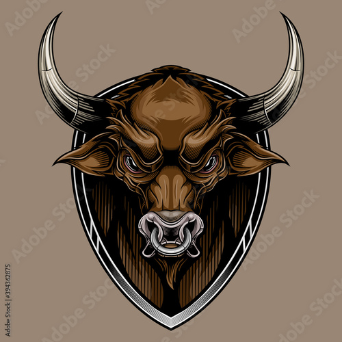 Bull head on shield mascot. Colorful vector illustration in stylish engraving technique of bull head with steel ring in his nose. Isolated on brown background.