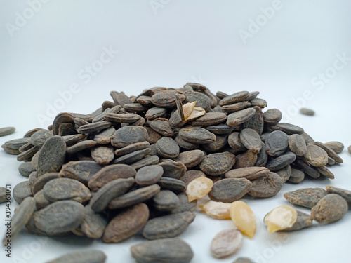 Guazi refers to baked plant seeds. It is a popular snack in China, Malaysia and especially in Indonesia. It usually refers to baked seeds of the sunflower, pumpkin or watermelon seeds. isolated 