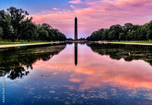 Washington Monument on the Reflecting Pool in Washington, DC, USA at dawn.
