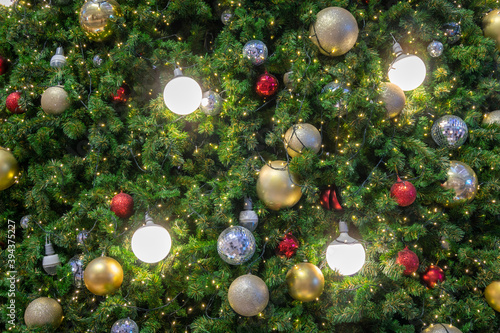Many ball and light decoration on christmas tree in celebrate festival. Copy space background