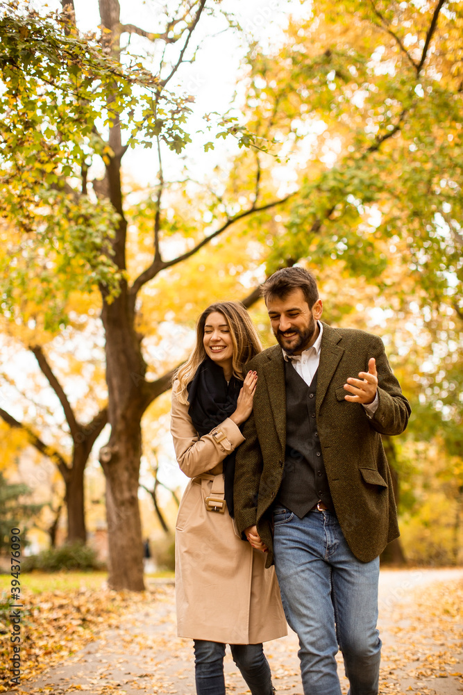 Young couple walking in the autumn park Young couple walking in the autumn park