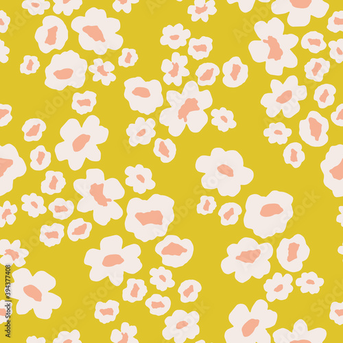 Scattered daisy floral pattern in yellow and pink. Small flowers seamless vector background. Ditsy flower print for textile, home decor, wallpaper, gift wrap.