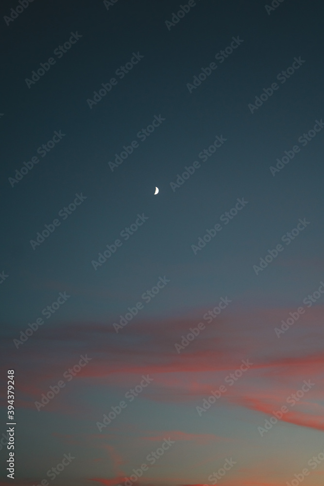 Crescent moon after sunset on a beautiful sky