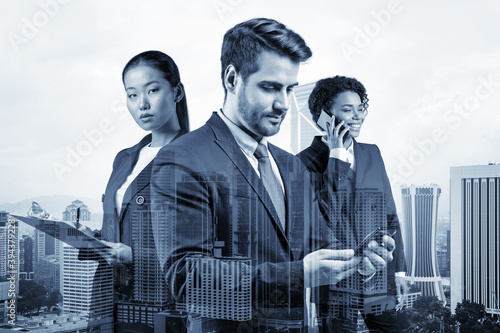 Photography Group of three business colleagues in suits working on project together to gain new career opportunities