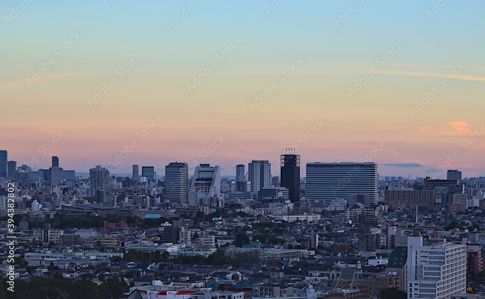 Aerial view of the Nakano skyline in the early evening under a partly cloudy sky
