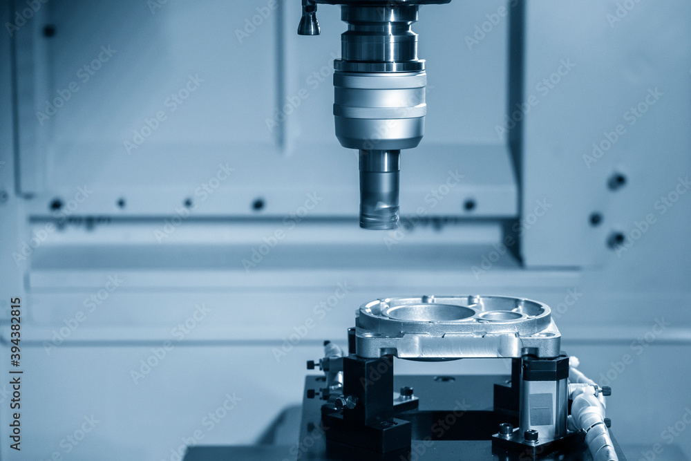 The CNC milling machine rough cutting the aluminum casting parts by indexable endmill tools. The automotive parts manufacturing process by machining center. The CNC milling machine rough cutting the aluminum casting parts by indexable endmill tools. The automotive parts manufacturing process by machining center.