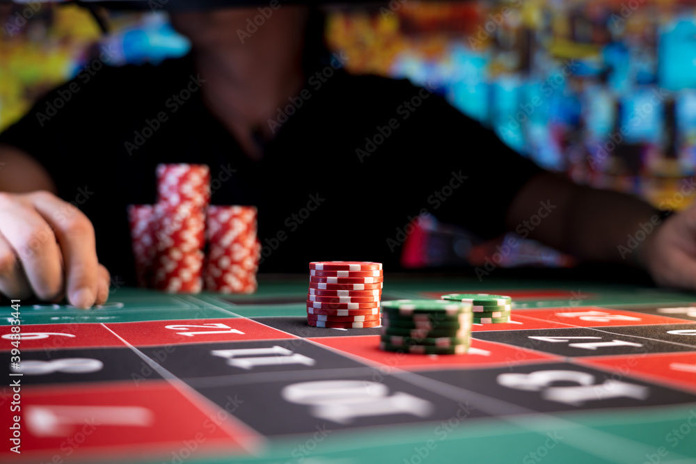 Man playing at the roulette table Man playing at the roulette table