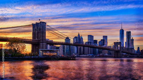 Brooklyn bridge East river and Manhattan after sunset, New York City