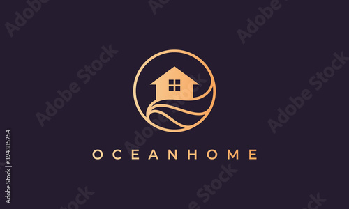 home logo of gold line with house in circle shape with ocean wave