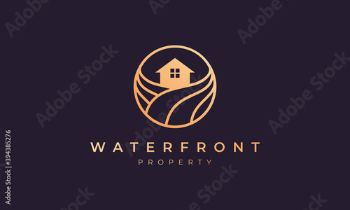 apartment logo of gold line with house in circle shape with ocean wave