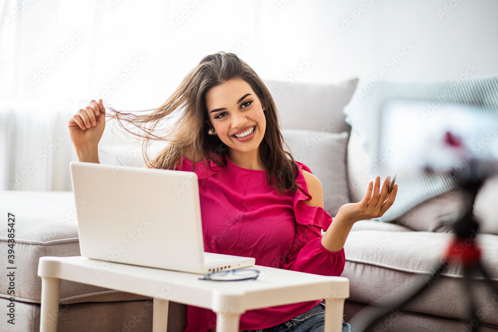 Young attractive asian woman blogger or vlogger looking at camera and talking on video shooting with technology. Social media influencer people or content maker concept in relax casual style at home. Young attractive asian woman blogger or vlogger looking at camera and talking on video shooting with technology. Social media influencer people or content maker concept in relax casual style at home.