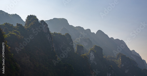 Limestone mountains with trees in the sea in Thailand