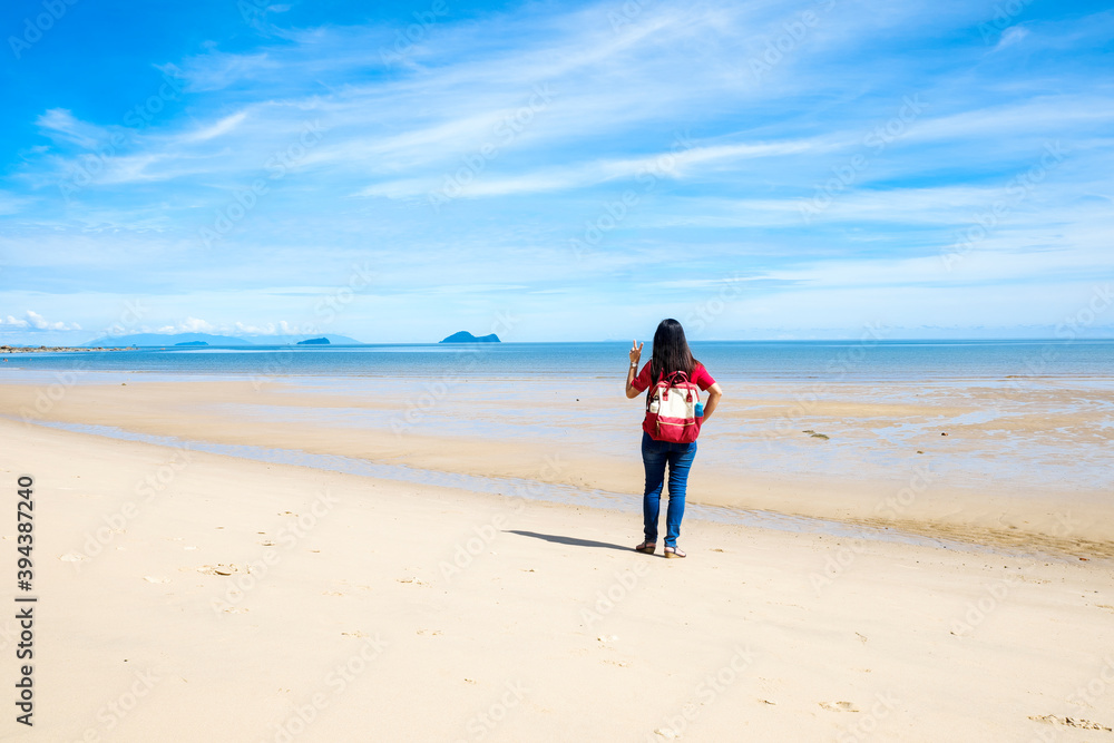 Woman Alone On Deserted Beach