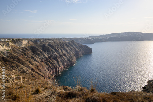The impressive cliffs of the Akrotiri Peninsula viewed from Megalochori village on the island of Santorini. Cyclades, Greece