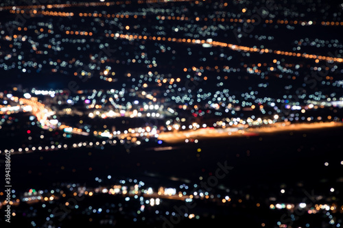 Blurred aerial view light bokeh city landscape at night in Chiang mai