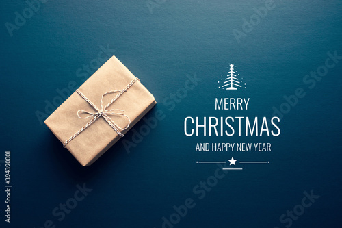 Brown gift box in diy and merry christmas text on dark background