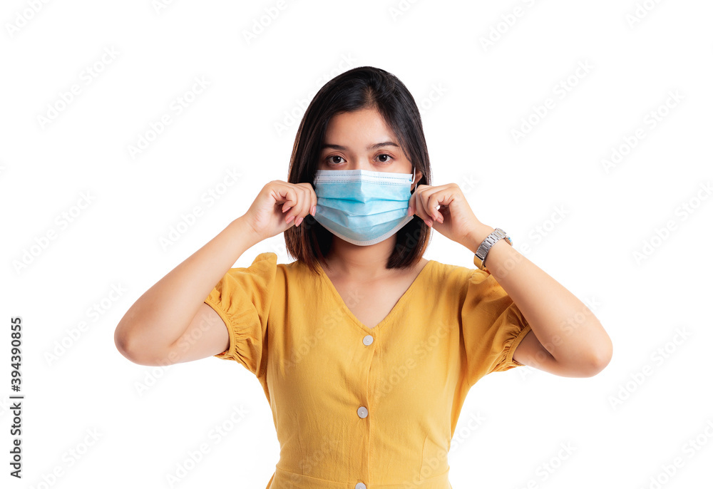 Young Asian woman wearing protection mask isolated on white background. Young Asian woman wearing protection mask isolated on white background.