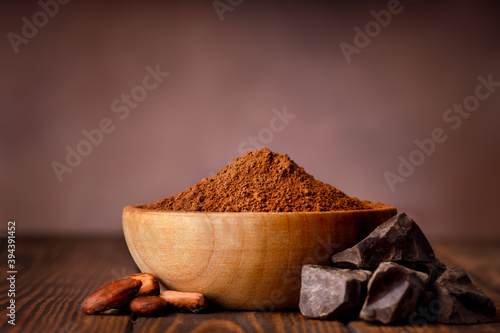 cacao powder in wooden bowl photo