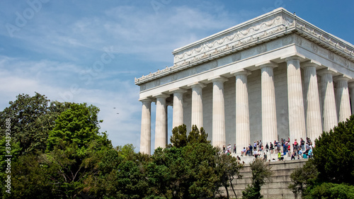 Visitors on the steps of Lincoln Memorial at sunrise. 