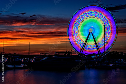 Illuminated Capital Wheel ferris ride at National Harbor near Washington DC at sunset