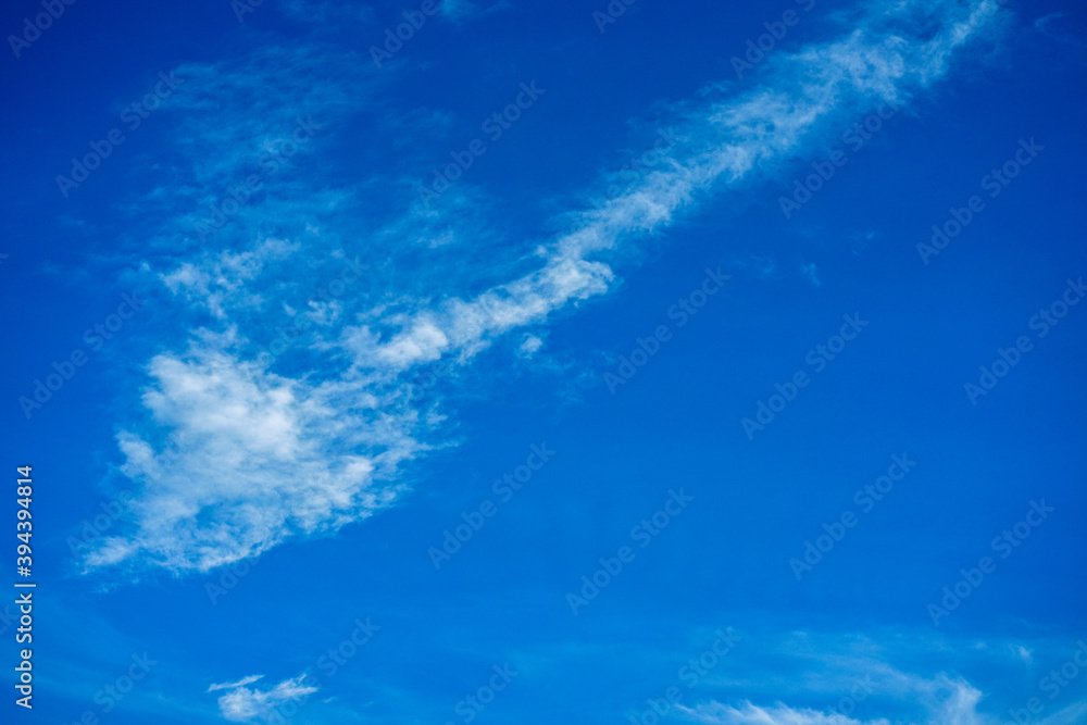 Wallpaper of White clouds on blue sky with copy space for banner background Wallpaper of White clouds on blue sky with copy space for banner background