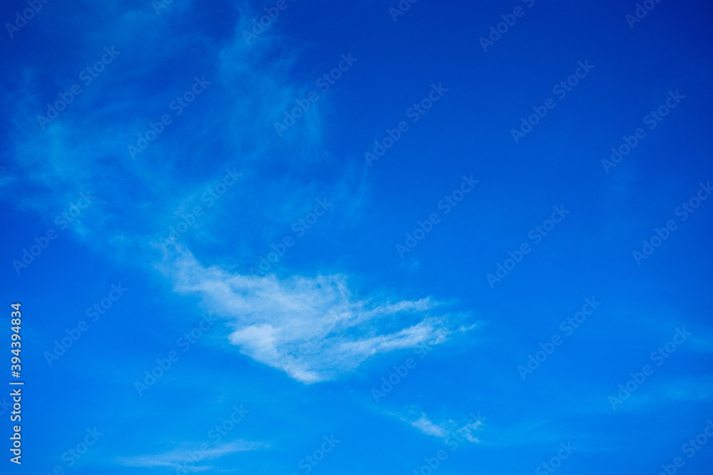 Wallpaper of White clouds on blue sky with copy space for banner background Wallpaper of White clouds on blue sky with copy space for banner background