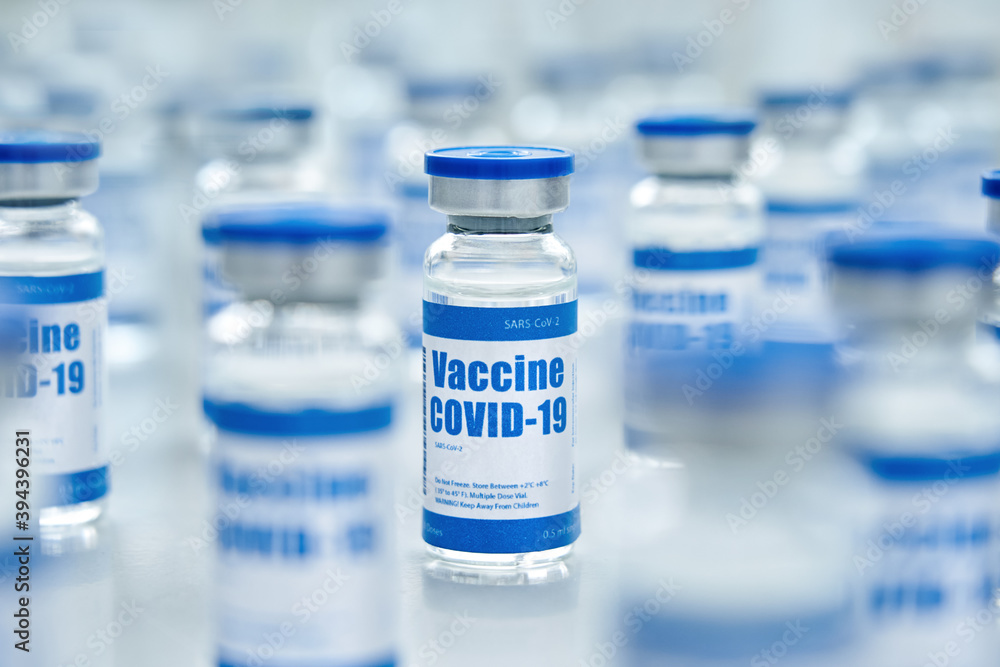 Covid 19 coronavirus vaccine vial bottle for intramuscular injections on medical pharmaceutical industry background. Corona virus cure manufacture, flu treatment drug pharmacy production concept. Covid 19 coronavirus vaccine vial bottle for intramuscular injections on medical pharmaceutical industry background. Corona virus cure manufacture, flu treatment drug pharmacy production concept.