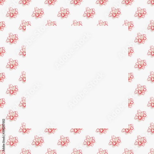Framed floral from blossoming delicate flowers of peony lily, white blooming lilies flower with red border. Floral ornament