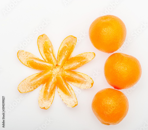 Fresh ripe orange fruits and orange slice isolated on the white background