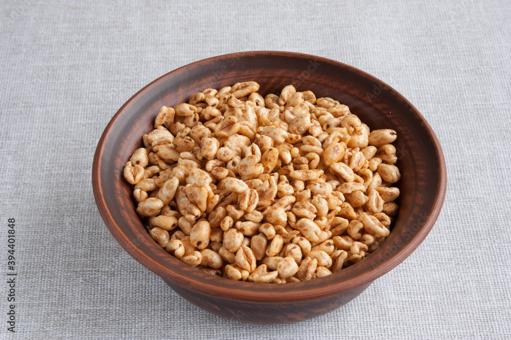 delicious airy wheat in honey glaze in a clay bowl delicious airy wheat in honey glaze in a clay bowl