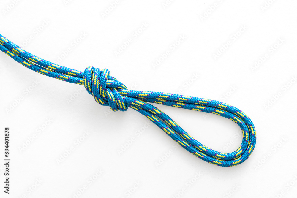 Figure 8 double loop knot pulled tight on a white background