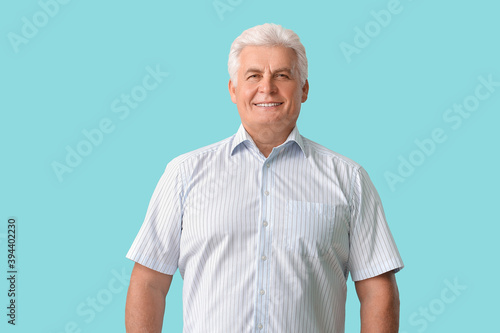 Stylish senior man on color...