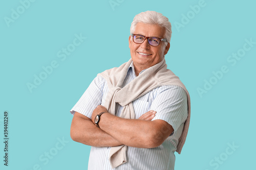 Stylish senior man on color...