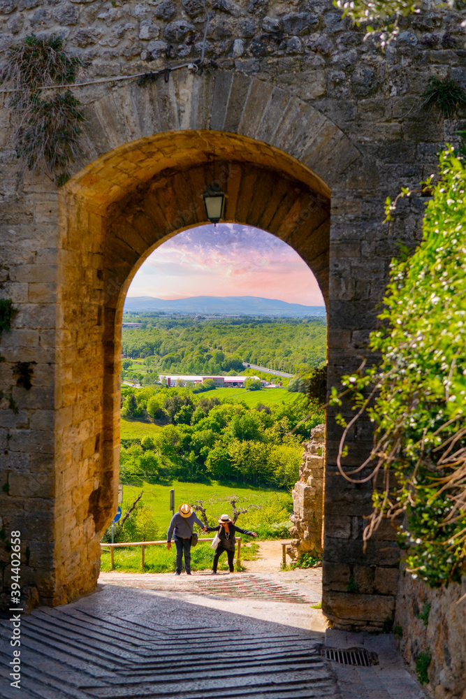 MONTERIGGIONI,ITALY - SEPTEMBER 4,2020 - View of the gate to the walls of the medieval town of Monteriggioni in Italy