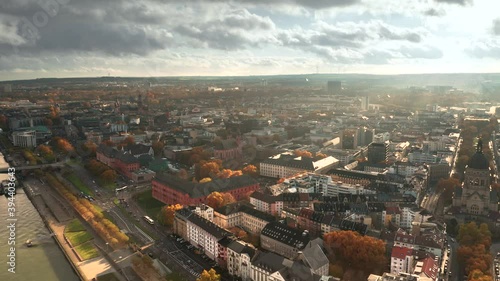 Wallpaper Mural Drone shot of Mainz the City of Biontech vaccine against Corona Covid 19 in Germany from an aerial view in golden fall light and dramatic sky over redish tree leaves Torontodigital.ca