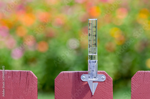 Closeup of rain gauge with rainwater, Concept of weather, rain, drought, flooding and precipitation.
 
 photo