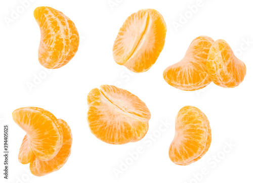 Fresh Mandarines, tangerine, clementine slices  isolated on white background. Pattern. Top view. Flat lay.