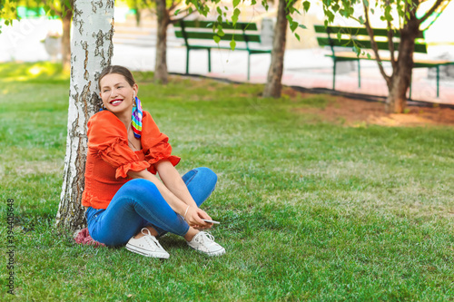 Beautiful young woman liste...