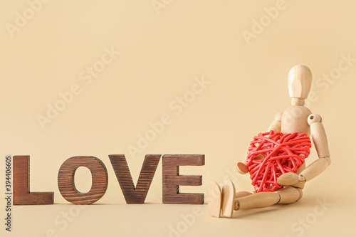 Wooden mannequin with word ...