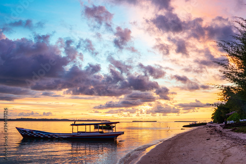 Sunset colorful sky on sea, tropical desert beach, no people, dramatic clouds, travel destination getting away, long exposure Indonesia Sumatra Banyak Islands