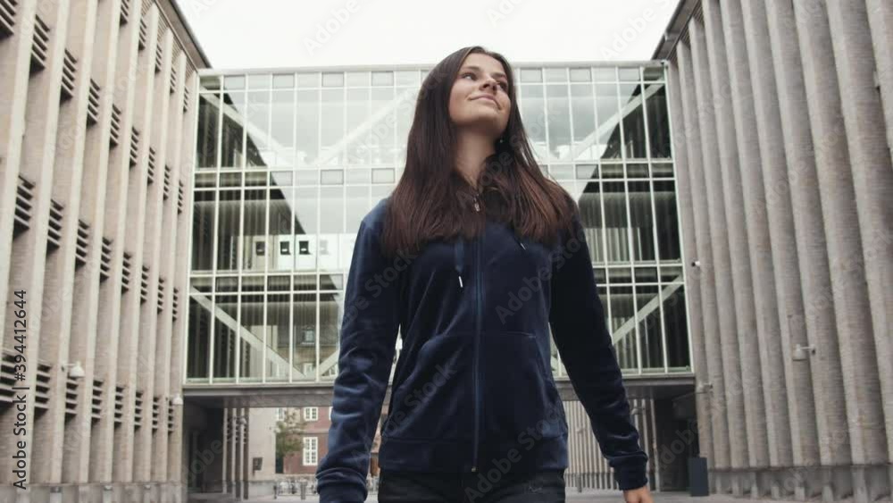 Young Teenage Model in Jacket Walking Outdoors Smiling Under Clear Bright Sky Young Teenage Model in Jacket Walking Outdoors Smiling Under Clear Bright Sky