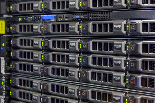 Network servers in a data center. Tier III carrier neutral data center. Server rooms.
