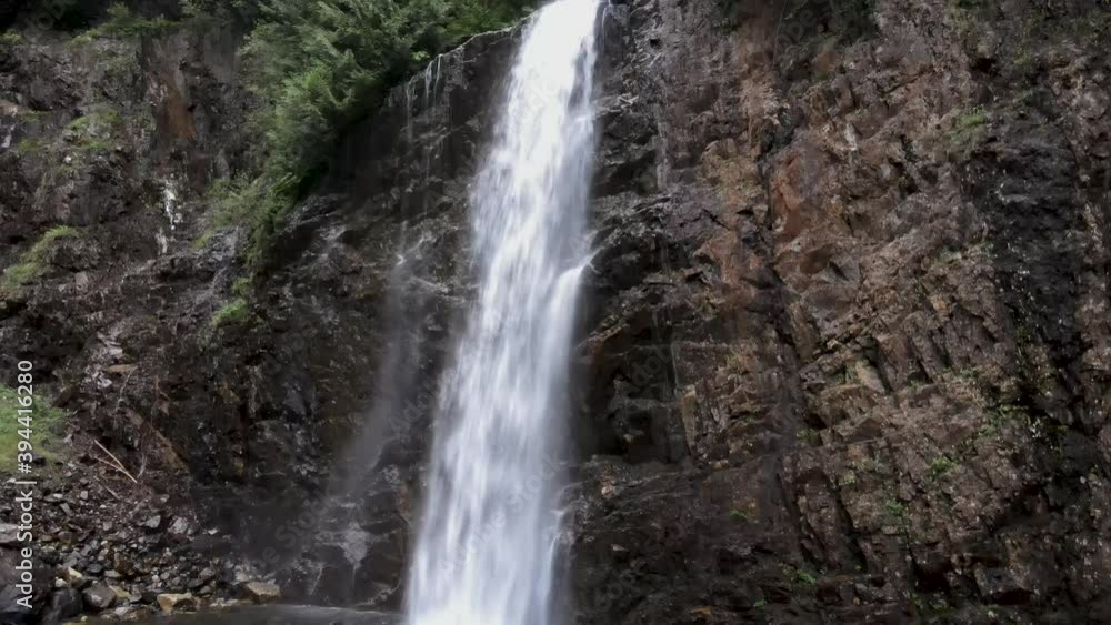 Tracking up pristine waters flowing over Franklin Falls, Evergreen forest, aerial Tracking up pristine waters flowing over Franklin Falls, Evergreen forest, aerial
