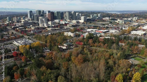 Aerial / drone footage of Bellevue, Washington downtown with residential and commercial highrise buildings along Interstate highway 405 in King County photo