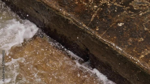 Waves Crash Against Steps in Cartagena Colombia photo