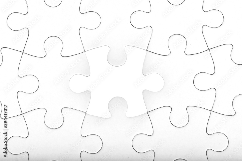 White jigsaw puzzle pattern background. placing last piece of jigsaw puzzle White jigsaw puzzle pattern background. placing last piece of jigsaw puzzle