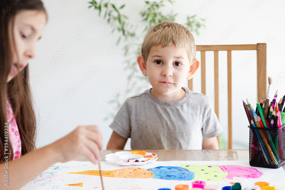 Cute toddler boy spending time with his sister Cute toddler boy spending time with his sister