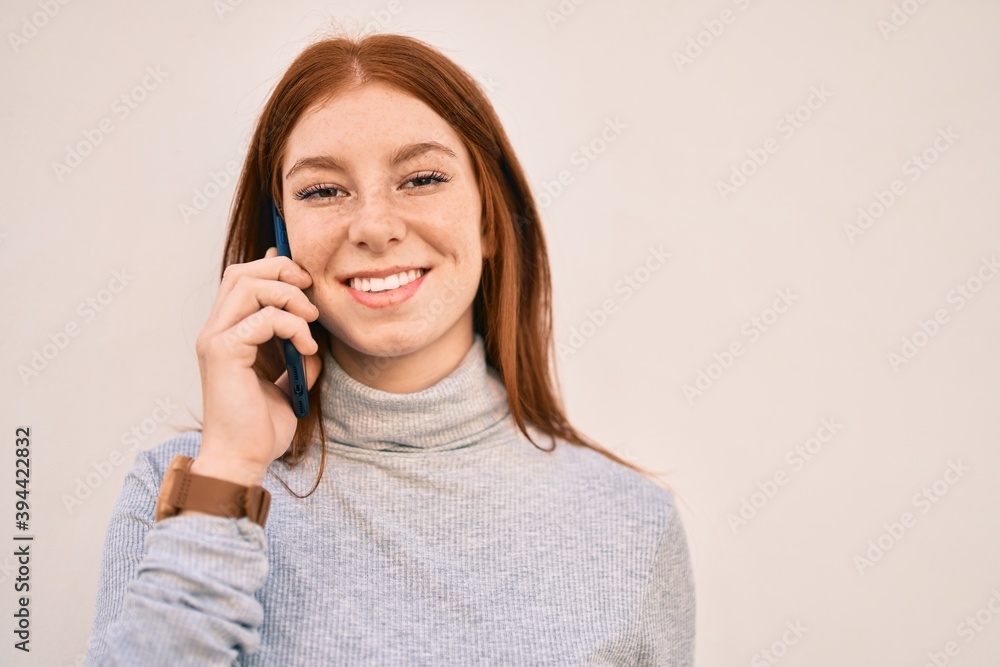 Young irish teenager girl smiling happy talking on the smartphone at the city. Young irish teenager girl smiling happy talking on the smartphone at the city.
